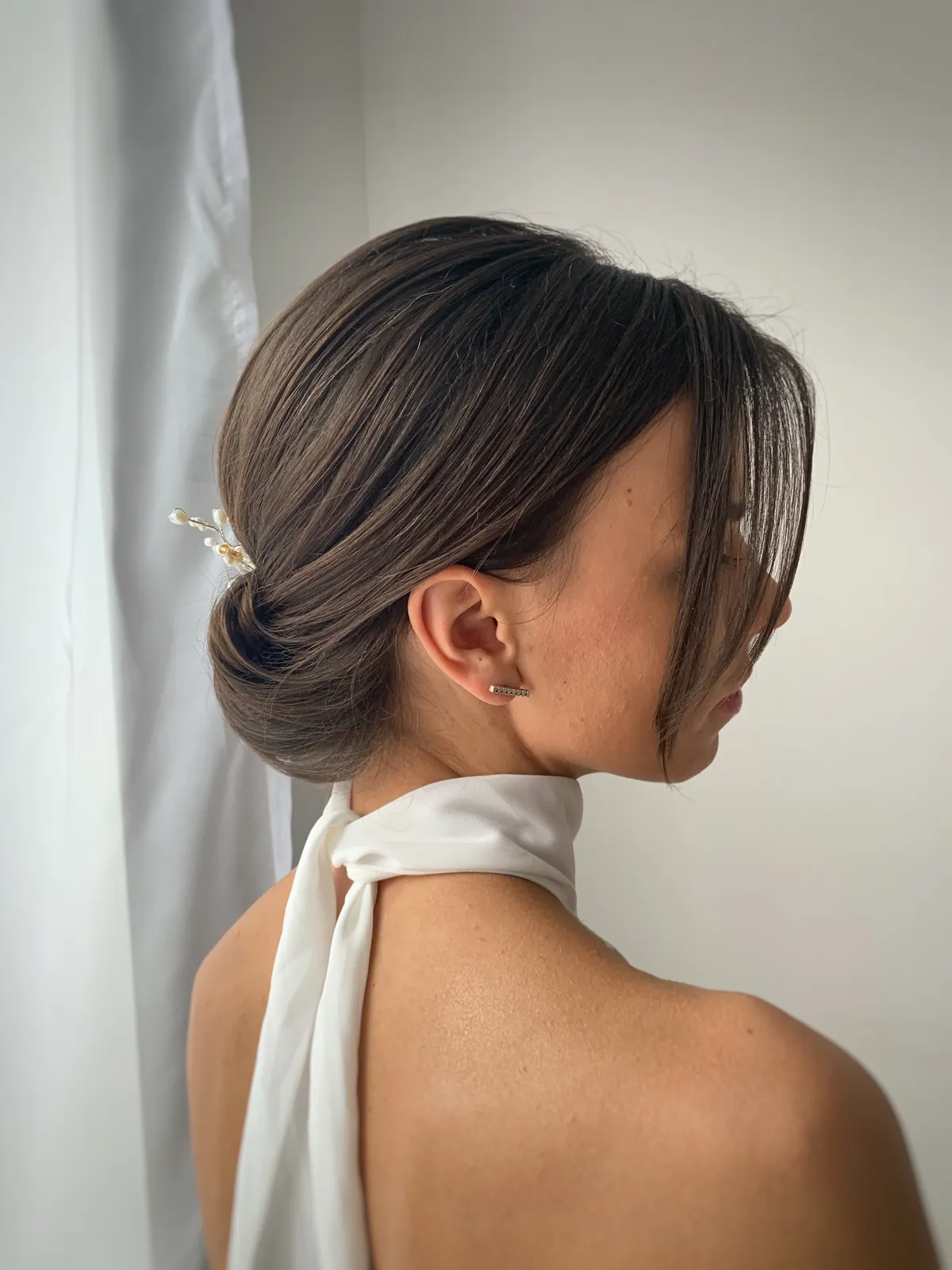 Professional bridal updo hairstyle by Sylwia Hubicka — hair salon Krakow